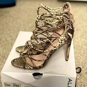 Aldo cage heels. Animal print, mainly cream & brown w/ specs of black & grey.